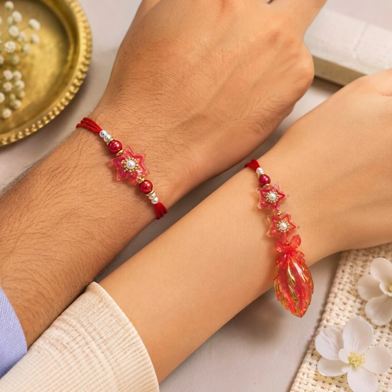 Red Star Beads Bhaiya-Bhabhi Rakhi & Lumba Set 3 Star Beads Bhaiya Bhabhi Rakhi & Leaf Lumba
