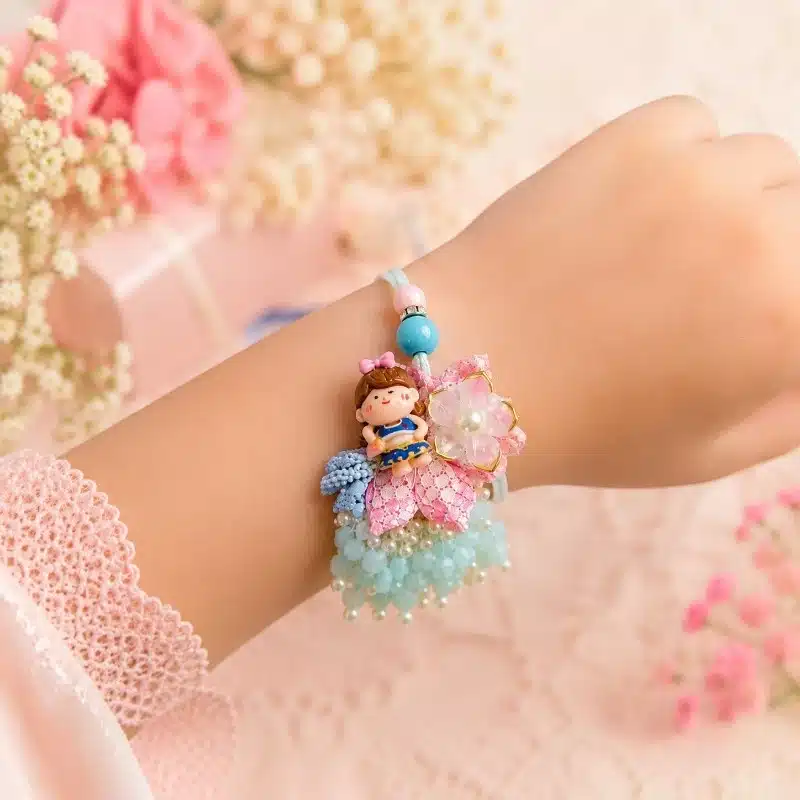 Floral Pink Doll Kids Lumba Rakhi with Pearl Tassels 3 Pink Doll Kids Lumba Rakhi