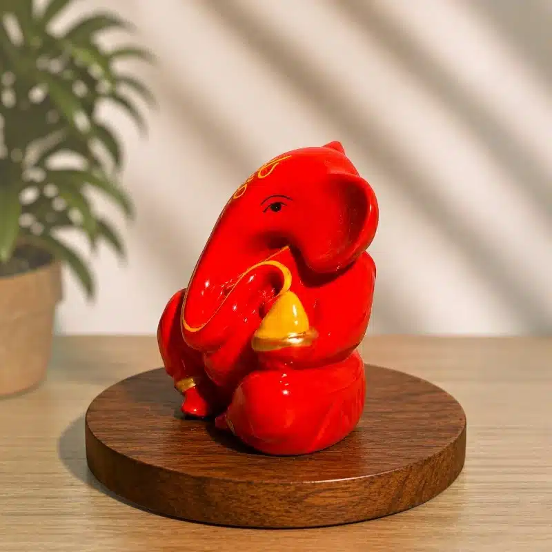 Orange Dashboard Ganesha Idol – Small Ganesh Ji for Car 2 Orange Dashboard Ganesha Idol